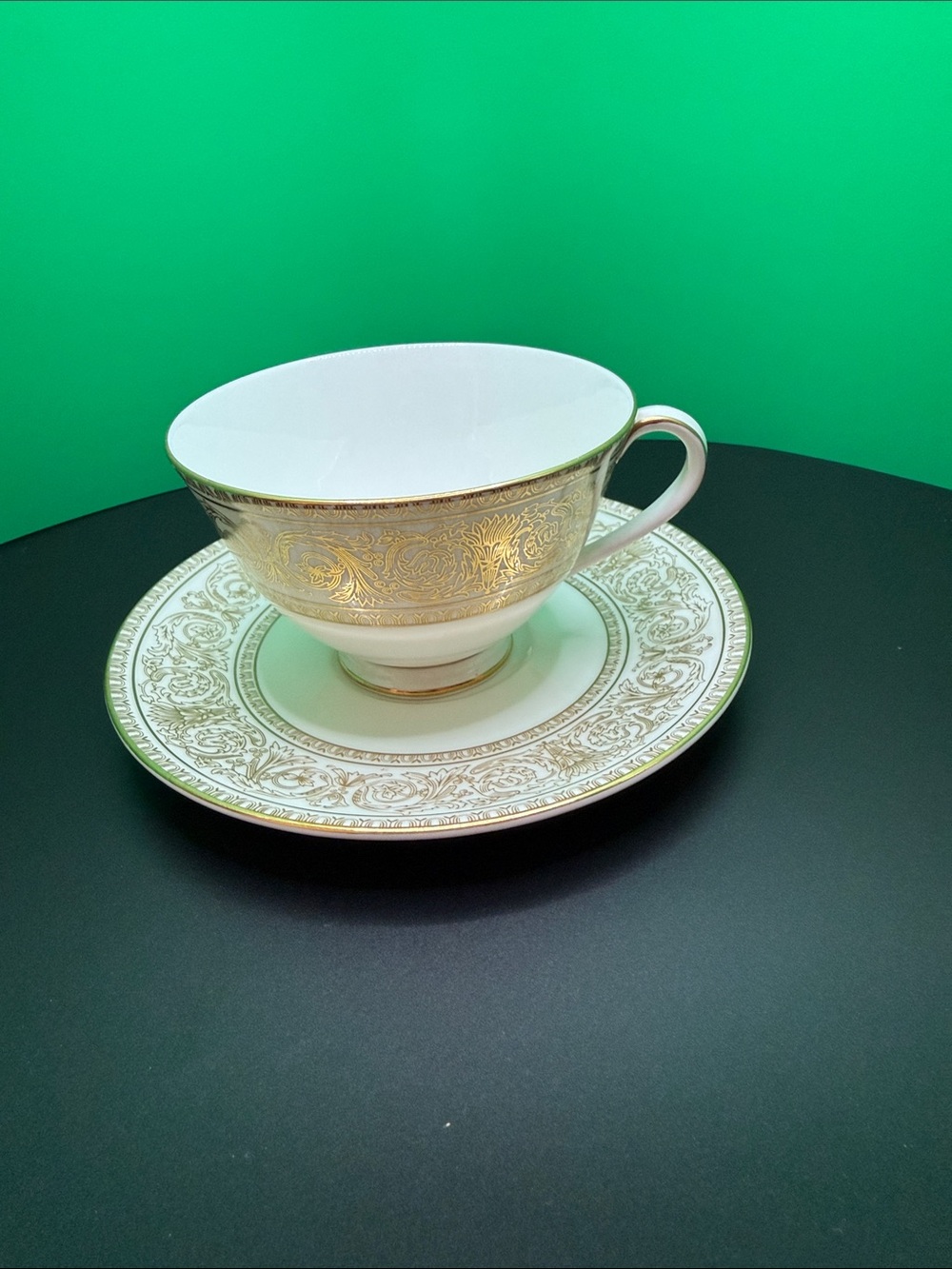 Elegant White and Gold Porcelain Teacup with Saucer